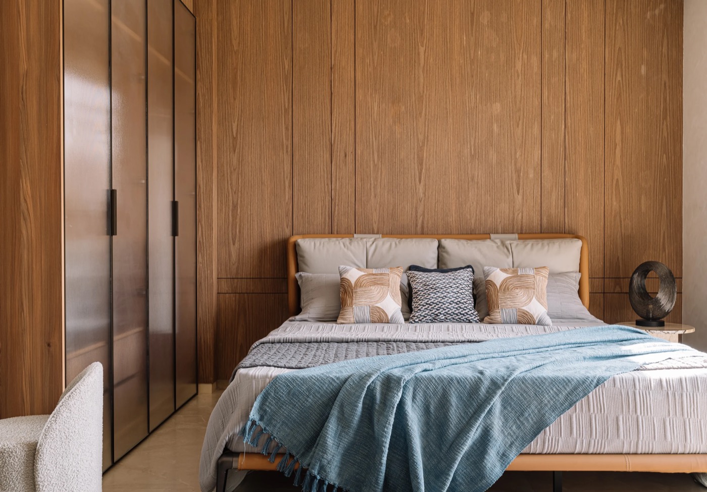 Finished bedroom at Kent Eco Sanctum with veneer wall panelling and wardrobes